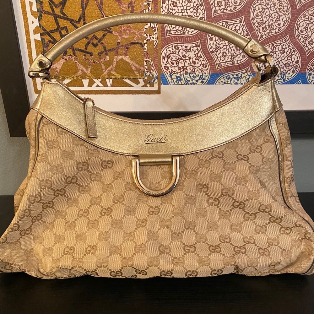 Gucci monogram large D gold hobo bag